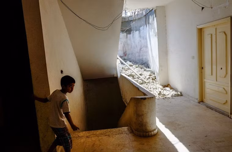 Cậu bé Syria ở Halba, Lebanon năm 2013.