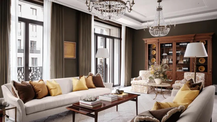 Tầng một của dinh thự là phòng tiếp khách lớn dài 9 m. Căn phòng sử dụng cửa sổ kính kéo từ sàn đến sát trần và lan can sắt được thiết kế riêng.