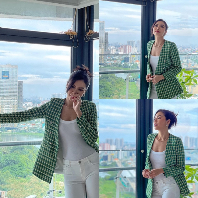 Thời thượng, sành điệu, Minh Tú bắt kịp xu hướng với mẫu áo blazer chất liệu dạ tweed sang chảnh. Là điểm nhấn cho cả cây màu trắng, Minh Tú xuất hiện kiêu kỳ và cuốn hút.