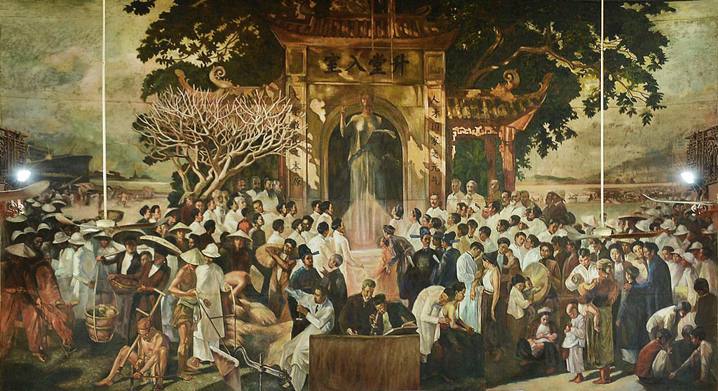 Bức tranh của Victor Tardieu ở Đại học Đông Dương (phục chế). Trên diện tích 77m2, ông đã tái hiện lại khung cảnh xã hội Việt Nam thời bấy giờ một cách chân thực. Tác phẩm được vẽ tại chỗ với những người làm mẫu địa phương, được hoàn thành sau 6 năm.