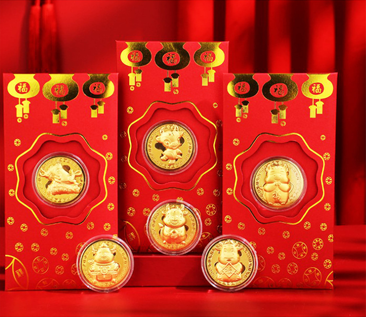 Bao lì xì hình trâu và thần tài mạ vàng cháy hàng dịp Tết Bao li xi hinh trau va than tai ma vang chay hang dip Tet