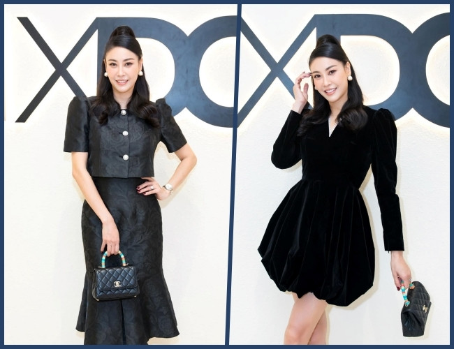 Cùng một kiểu tóc, lối trang điểm và túi xách tương tự, Hà Kiều Anh khi thì cổ điển với áo tay phồng và chân váy xòe đuôi cá vải gấm cao cấp, lúc lại đài các trong chiếc váy nhung dài tay thân bồng, ngắn trên gối. Cả hai bộ trang phục được kết hợp hoàn hảo với hoa tai ngọc trai và túi Chanel nhỏ xinh gần 120 triệu đồng.