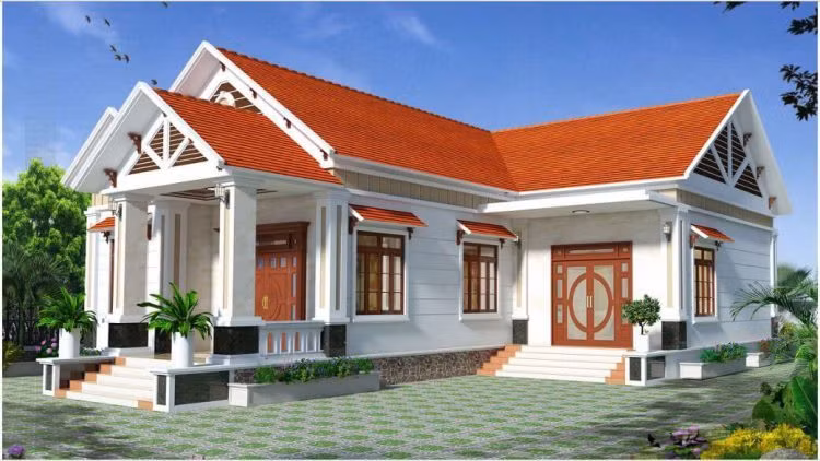 Căn nhà chữ L 1 tầng được xây dựng theo phong cách tân cổ điển sang trọng, mái thái và hệ thống cửa đồng màu, tạo thành một thể thống nhất