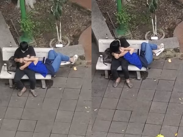 Cap doi sinh vien than nhien om hon, nam len dui noi cong cong