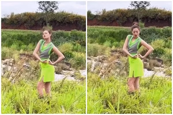 Khánh Vân tạo dáng lực điền cực hài giữa đồng ruộng mênh mông. Mặc dù là một Hoa hậu nhưng Khánh Vân vẫn tự nhiên "bộc lộ" cá tính của mình.