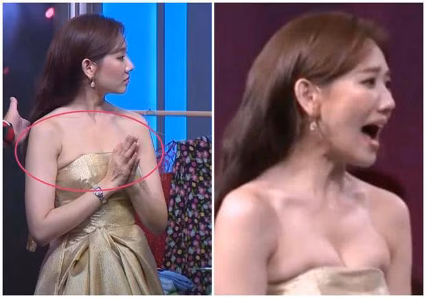 Hari Won gây thấp thỏm vì vòng một như sắp bị đè nát bởi viền váy áo. Chiếc váy còn làm ngực nữ ca sĩ "chạy" sang hai bên nách.