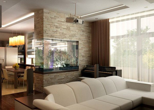 Thêm một kiểu vách ngăn có tác dụng "kép" bởi nó không chỉ là vật phân chia không gian sống trong nhà mà còn là vật trang trí giúp nhà thêm sinh động, đẹp mắt. Vách ngăn bể cá với kích thước bể cá to hay nhỏ, vị trí treo bể cá cao hay thấp tuỳ theo sở thích. Đây cũng là cách rất hay để đưa bể cá phong thuỷ vào trong nhà mà không làm tốn nhiều diện tích.