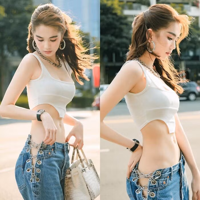 Cũng là áo croptop nhưng chính đường cắt thú vị dưới lai áo đã mang đến điểm nhấn nhá thú vị cho set đồ. 
