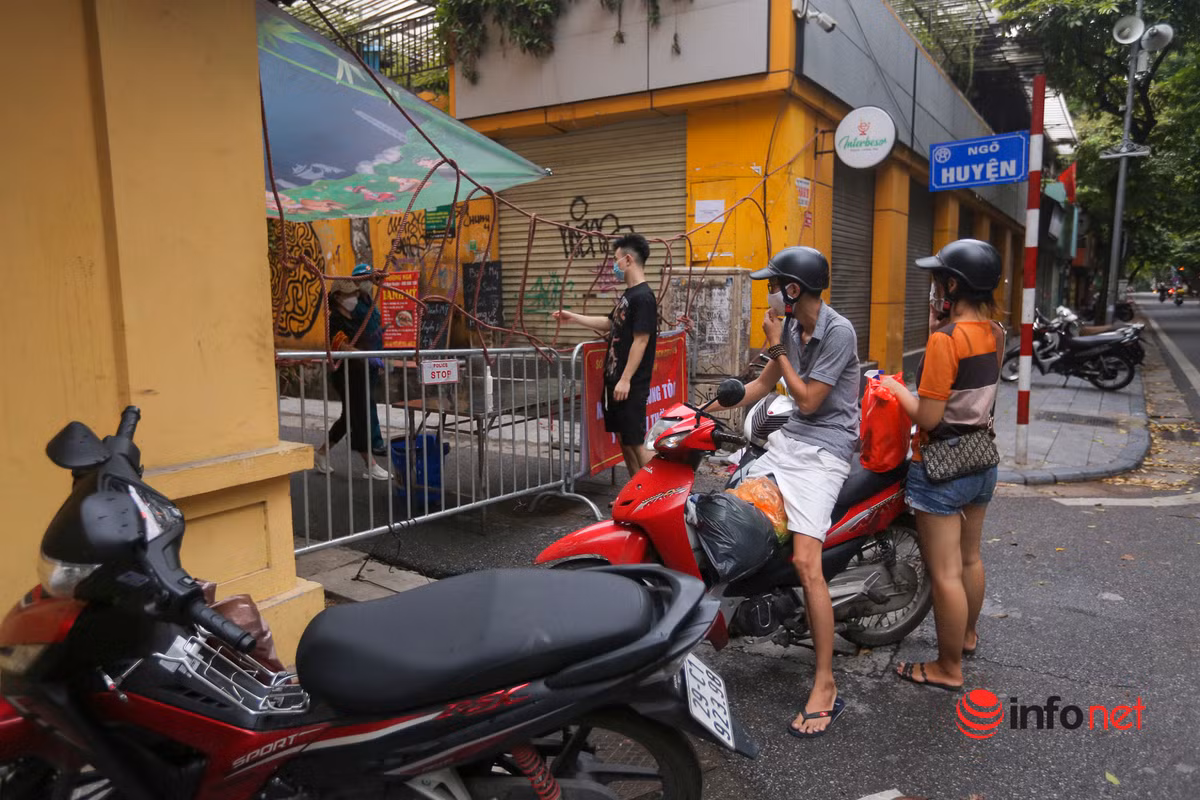 Phong toa nhieu con pho gan BV Viet Duc, khoang 1.000 nguoi nha benh nhan di cach ly-Hinh-8