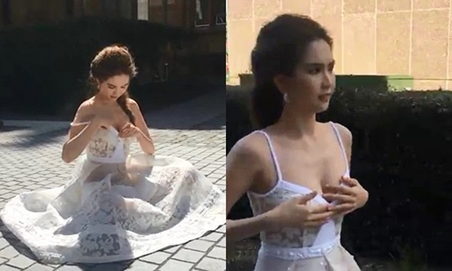 Diện thiết kế cúp ngực, Ngọc Trinh phải chỉnh trang để trang phục chỉn chu hơn.