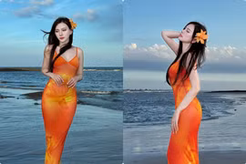 Thu Thủy diện váy cam rực rỡ, khoe vóc dáng nuột nà bên biển