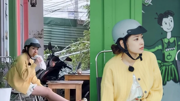 Chi Pu mặc đồ ngủ, đội mũ bảo hiểm gặm bánh mì lề đường