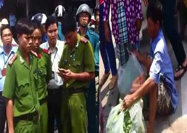 Ngồi khóc vì công an không cho bán rau
