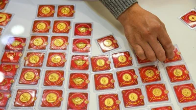 Vàng SJC và DOJI giảm 400.000 đồng/lượng chiều 4/7
