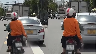 TP HCM xác minh vụ người phụ nữ mặc áo cam rải bột “lạ” trên đường