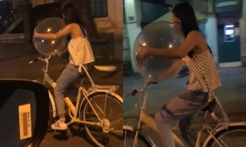 Video: Cô gái vừa đạp xe vừa hít bóng cười gây xôn xao MXH