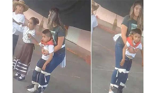 Video: Cô giáo buộc chặt cậu bé vào người để tham gia nhảy cùng các bạn