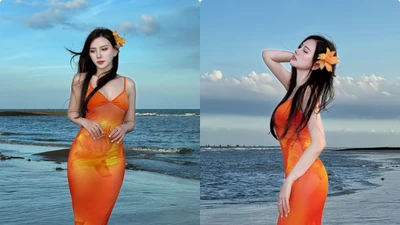 Thu Thủy diện váy cam rực rỡ, khoe vóc dáng nuột nà bên biển