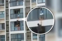 Nghẹt thở giải cứu cậu bé mắc kẹt ở ban công tầng 14