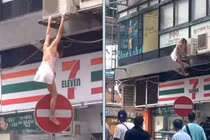 Cô gái gây xôn xao vì ăn mặc “mát mẻ” đu cửa sổ