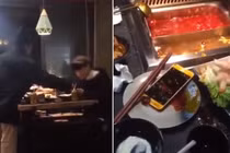 Gái trẻ thẳng tay ném điện thoại của người yêu vào nồi lẩu