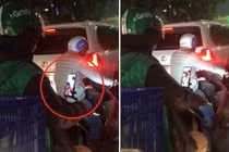 Dừng chờ đèn đỏ, tài xế Grab tranh thủ gọi điện cho vợ con