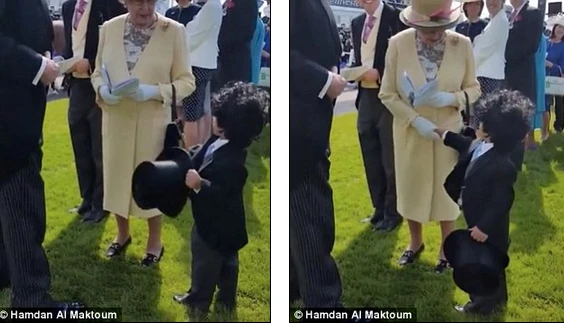 Hé lộ thân thế khủng cậu bé bắt tay nữ hoàng Anh 