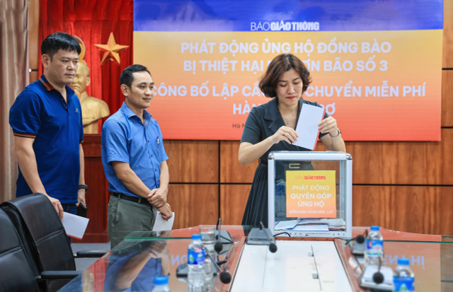 Lần đầu thiết lập cầu vận chuyển miễn phí hàng cứu trợ bão lũ - Hình 4 Lan dau thiet lap cau van chuyen mien phi hang cuu tro bao lu-Hinh-4