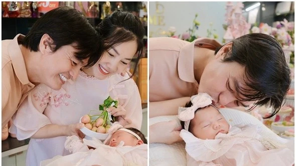 Vợ chồng Cao Minh Đạt hạnh phúc trong tiệc đầy tháng con gái