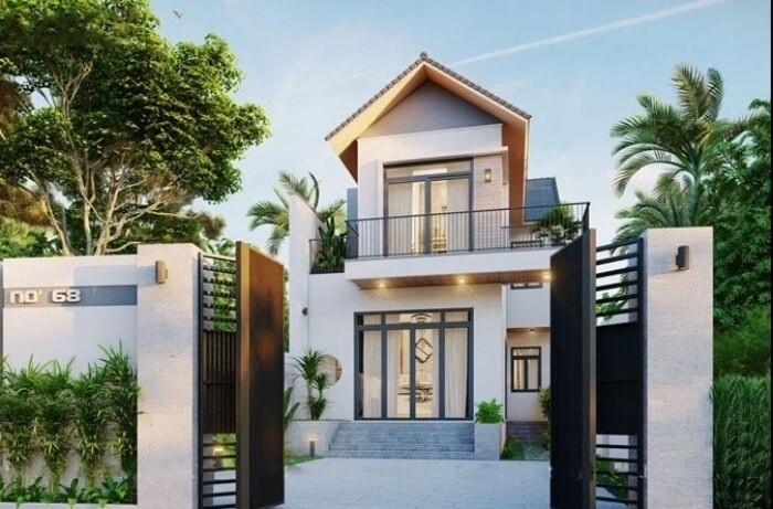 Mẫu nhà mái thái 2 tầng hiện đại có sự phối hợp nhịp nhàng giữa hình khối và màu sắc tươi sáng, tôn lên vẻ đẹp thanh lịch. Nổi bật là mái ngói nâu đen theo hình chữ T mang đến chiều sâu cho ngôi nhà. (Ảnh: Datthu)