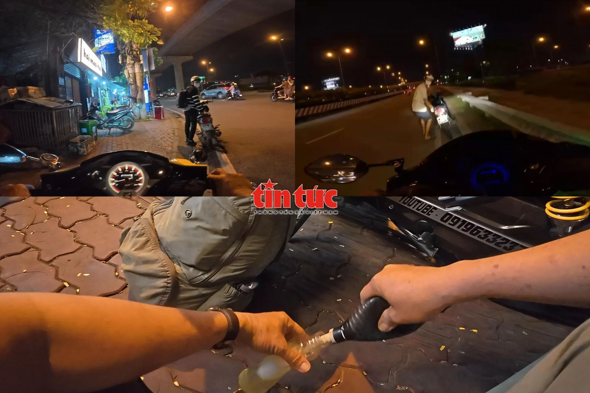 Ông Long hỗ trợ xăng cho người đi đường phải dắt xe do hết xăng vào ban đêm.