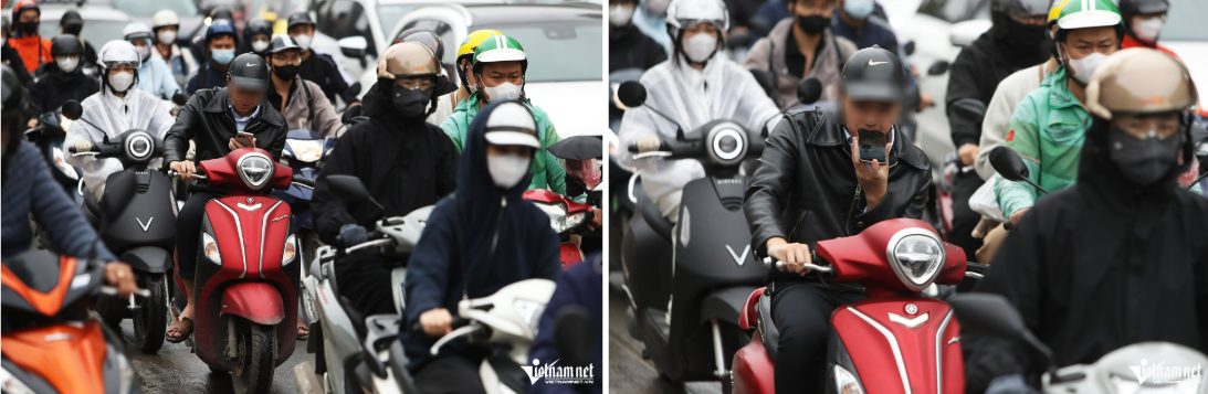 Người đàn ông điều khiển xe máy nhãn hiệu Yamaha Grande (màu đỏ) dùng một tay để cầm điện thoại, tay còn lại lái xe trên một đoạn đường dài.