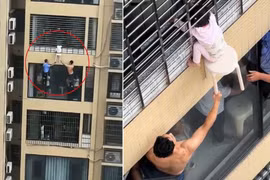 Bé gái ba tuổi kẹt đầu lan can tầng 12, hàng xóm dùng ghế để giải cứu