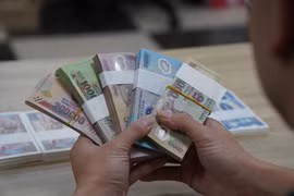 Chấp nhận mất phí cao đổi tiền mới dịp Tết