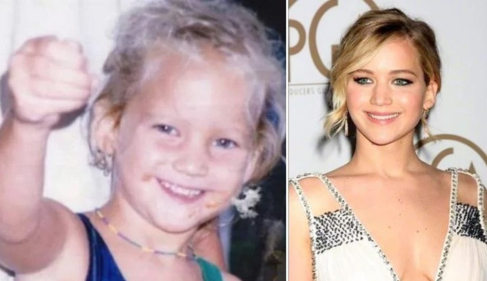 Cô bé tóc xù màu khói, nở nụ cười tươi rói dễ thương này chính là ngôi sao Hollywood Jennifer Lawrence.