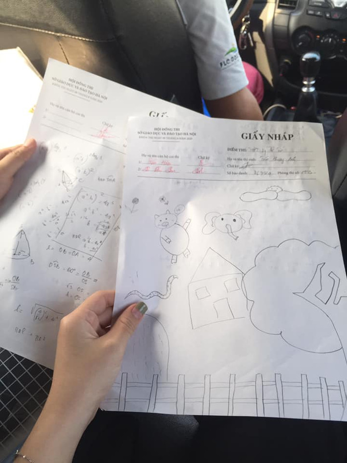 Hai tờ giấy nháp thể hiện sự đối lập hoàn toàn, một bên là chăm chú giải đề bài, thí sinh còn lại lại lựa chọn vẽ vời để giết thời gian.