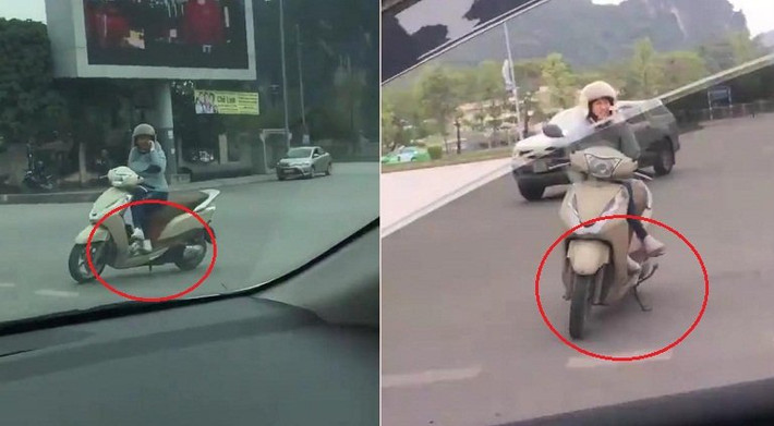 Một Honda Lead khác vô tư dừng xe, dựng chân chống đàng hoàng, ngồi vắt vẻo trên xe để buôn điện thoại ngay ngã ba đường đúng là hành động dũng cảm không phải ai cũng dám thực hiện.