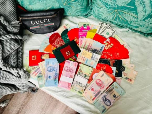 Sao Việt nô nức đi mua vàng trong ngày vía Thần Tài - Hình 12 Sao Viet no nuc di mua vang trong ngay via Than Tai-Hinh-12