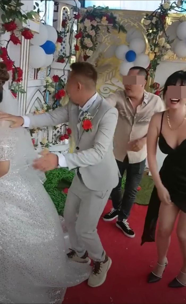 Cô gái 'ôm eo' hôn gió chú rể khiến cô dâu hủy hôn lên tiếng - Hình 3 Co gai 'om eo' hon gio chu re khien co dau huy hon len tieng-Hinh-3