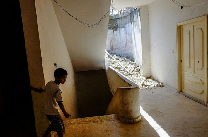 Cậu bé Syria ở Halba, Lebanon năm 2013.