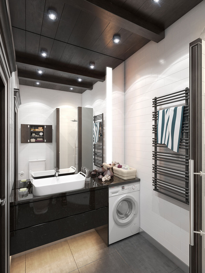 Thiết kế phòng tắm lát gạch với chiếc máy giặt được sắp xếp khéo léo, thích hợp với căn hộ nhỏ bé này.