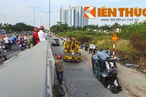 Ô tô biển xanh gặp nạn do bùn thải rải trên mặt cầu