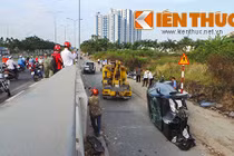 Ô tô biển xanh gặp nạn do bùn thải rải trên mặt cầu