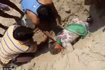 Tranh giành đất đai, cô gái suýt bị chôn sống 