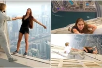 Chân dài liều mạng đu người trên nóc tòa nhà chọc trời