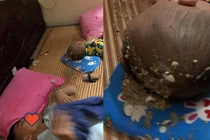 Ngán ngẩm cảnh ông chồng uống say về nôn cả vào đầu con