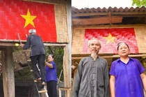 Cụ ông và cụ bà bắc thang, cùng nhau vẽ cờ Tổ quốc
