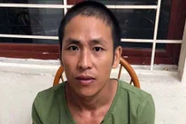 Thanh niên dùng liềm cắt cỏ khống chế con tin trong nhà