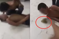 Ông bố bắt con nhổ nước bọt vào miệng nhau bất hợp tác với công an