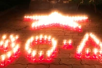 Hơn 15 ngàn ngôi mộ AHLS lung linh ngọn nến tri ân